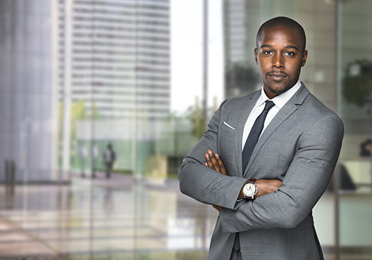 Man with crossed arms looking at the camera