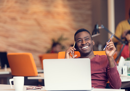 man sitting with laptop