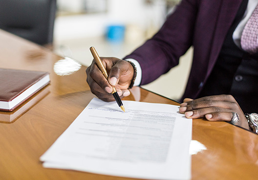 A man signing a document