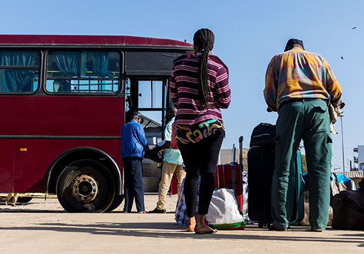 people standing outside a motor PSV