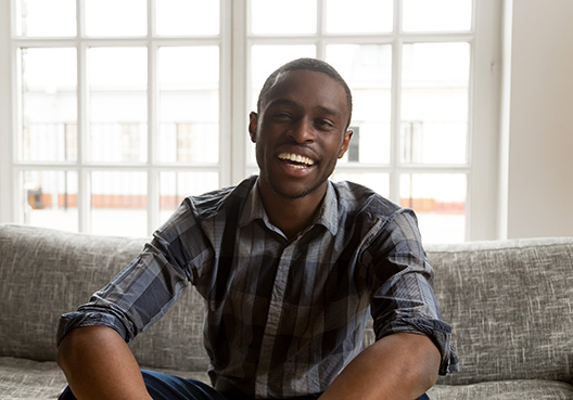 man sitting on the couch