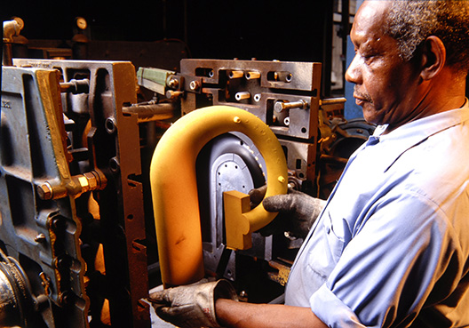 man standing by machines