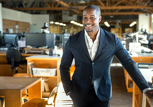 man with one hand in his pocket staring at the camera