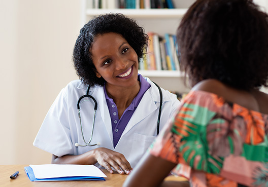 woman talking to a doctor