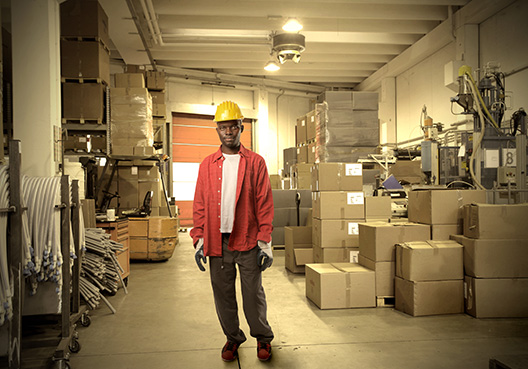 man standing in warehouse